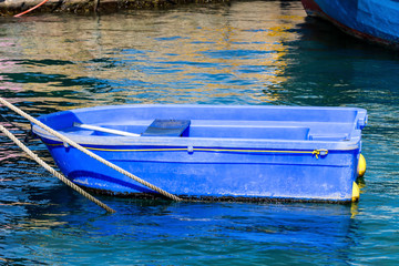 Little blue boat on the pier