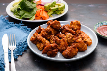 Chicken sixty five, a spicy fried chicken dish in India, Singapore and Sri Lanka.
