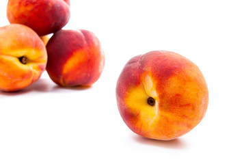 Group of ripe peach fruit isolated on white background.