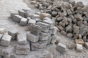 industrial installation pavement rocks cobblestone blocks on road pavement