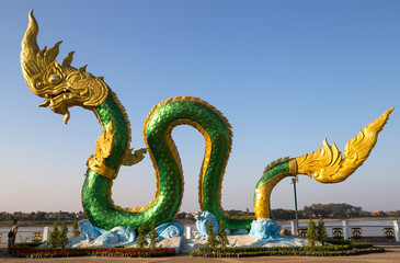 Fototapeta premium NONG KHAI, THAILAND, JANUARY 29, 2019 - Naga Statue in Nong Khai on Mekong River, Thailand.