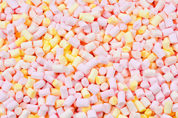 Marshmallow. Background of pink and yellow colorful mini marshmallows.
