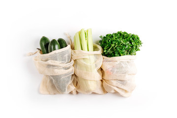 Organic vegetables and fresh green in reusable produce bags. Sustainable lifestyle. Plastic free...