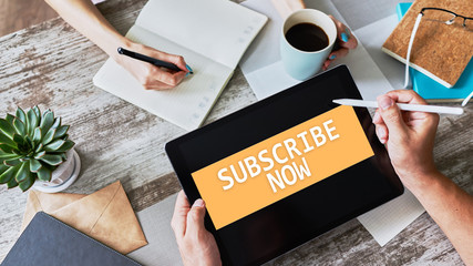 Subscribe button on device screen. Internet and digital marketing concept.