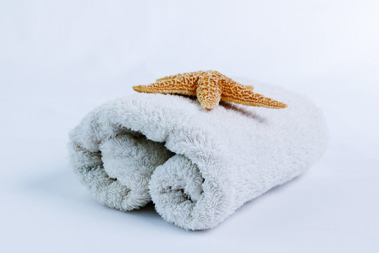 White fluffy bathroom towels on a white background
