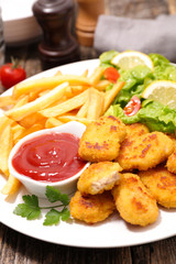fried nugget with french fries and ketchup