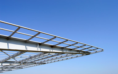 roof structure made of steel with blue sky.