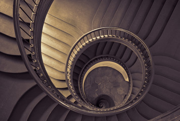 Antique spiral staircase in black and white.