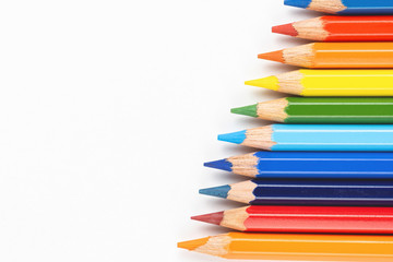 Fototapeta premium Set of colored pencils. Colors of rainbow. Colored pencils for drawing different colors on a white background.