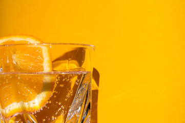 glass of mineral water with orange slice