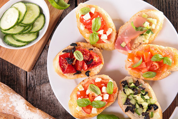 bruschettas with tomato,cheese, and olive