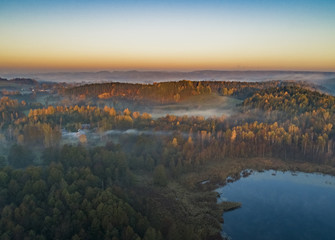 Sunrise, lakes, forests and a beautiful landscape - drone view