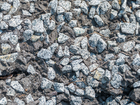 background image of rubble in a piece of concrete