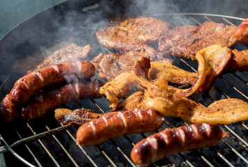 Unhealthy but tasty grilled sausages and meat