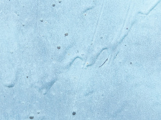 background image of blue paint smudges and rust on metal