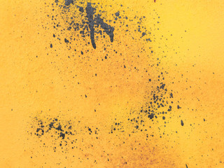 the background image on a yellow background with splashes of dark paint
