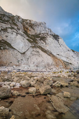 The rocky beach and cliffs near Beachy Head in Sussex, with evening light