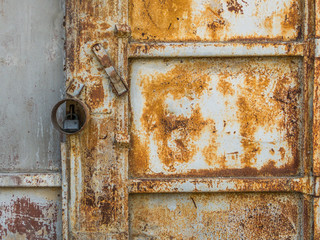 the background image of a rusty door and a padlock