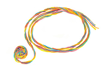 Colorful frame made of thread with thread ball isolated on white background.  Empty frame of cotton...
