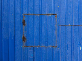 The background image of the rust and paint the metal wall with a hatch