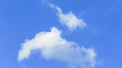 Fototapeta premium Beautiful white fluffy clouds with blue sky background. Nature weather, the vast cloud blue sky.