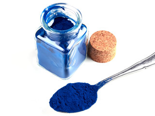 Blue Spirulina powder, isolated on white