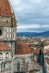 Fototapeta na wymiar View of ancient Florence from the tower of the Cathedral of Santa Maria del Fiore on a cloudy spring day