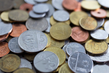 A pile of new and old Philippines peso coins