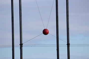 red ball between metal posts
