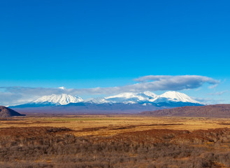 three volcanoes in Kamchatka Peninsula