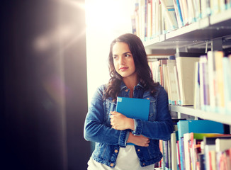education, high school, university, learning and people concept - student girl with book at library