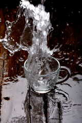Naklejka na ściany i meble water splash in glass cup