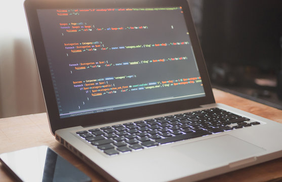 Computer code on laptop (web developing)