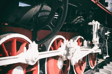 Retro steam locomotive wheels and rods. Details of mechanical parts, wheels and equipment of the train.