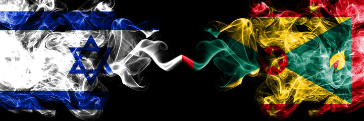 Israel vs Grenada smoky mystic flags placed side by side. Thick colored silky smokes flag of Israel...