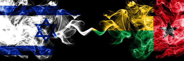 Israel vs Guinea Bissau smoky mystic flags placed side by side. Thick colored silky smokes flag of...