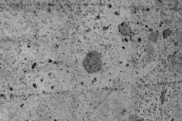 The concrete texture, wall, with cracks and scratches can be used as a background