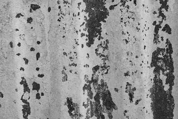 The concrete texture, wall, with cracks and scratches can be used as a background