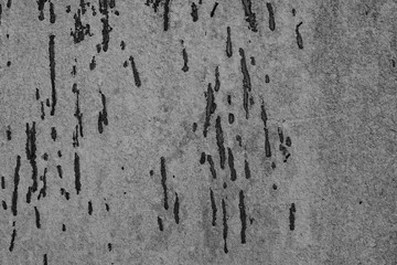 The concrete texture, wall, with cracks and scratches can be used as a background