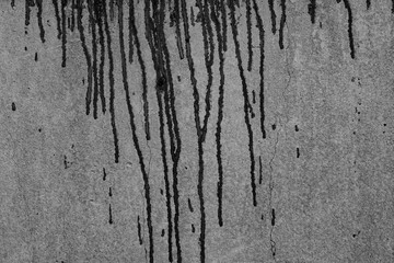 The concrete texture, wall, with cracks and scratches can be used as a background