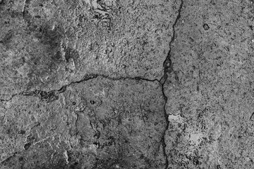 The concrete texture, wall, with cracks and scratches can be used as a background