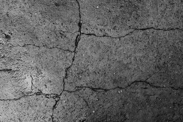 The concrete texture, wall, with cracks and scratches can be used as a background