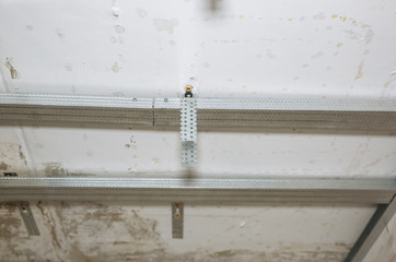 Metal planks for stretch ceiling. Maintenance repair works renovation in the flat. Restoration indoors.