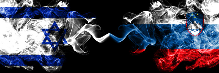 Israel vs Slovenia, Slovenian smoky mystic flags placed side by side. Thick colored silky smokes flag of Israel and Slovenia, Slovenian