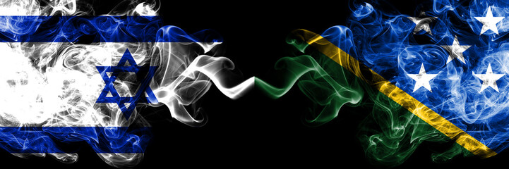 Israel vs Solomon Islands smoky mystic flags placed side by side. Thick colored silky smokes flag of Israel and Solomon Islands
