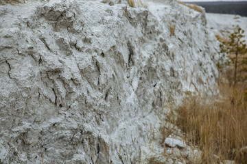 Grey stone and clay background. Sand texture. Phosphogypsum stack of chemical production wastes and oil.