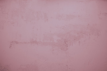 Rosa, lila farbene, verputzte Wand als Hintergrund. Steinwand, Betonwand im Industrial Style. Verschmutzte  und raue Strukturen über das ganze Bild. 