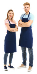 Obraz premium Man and woman in aprons on white background