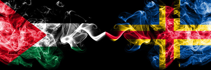 Palestine vs Aland smoky mystic flags placed side by side. Thick colored silky smokes flag of Palestinians and Aland