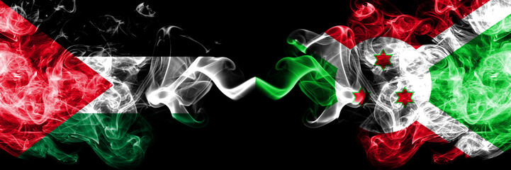 Palestine vs Burundi, Burundian smoky mystic flags placed side by side. Thick colored silky smokes flag of Palestinians and Burundi, Burundian